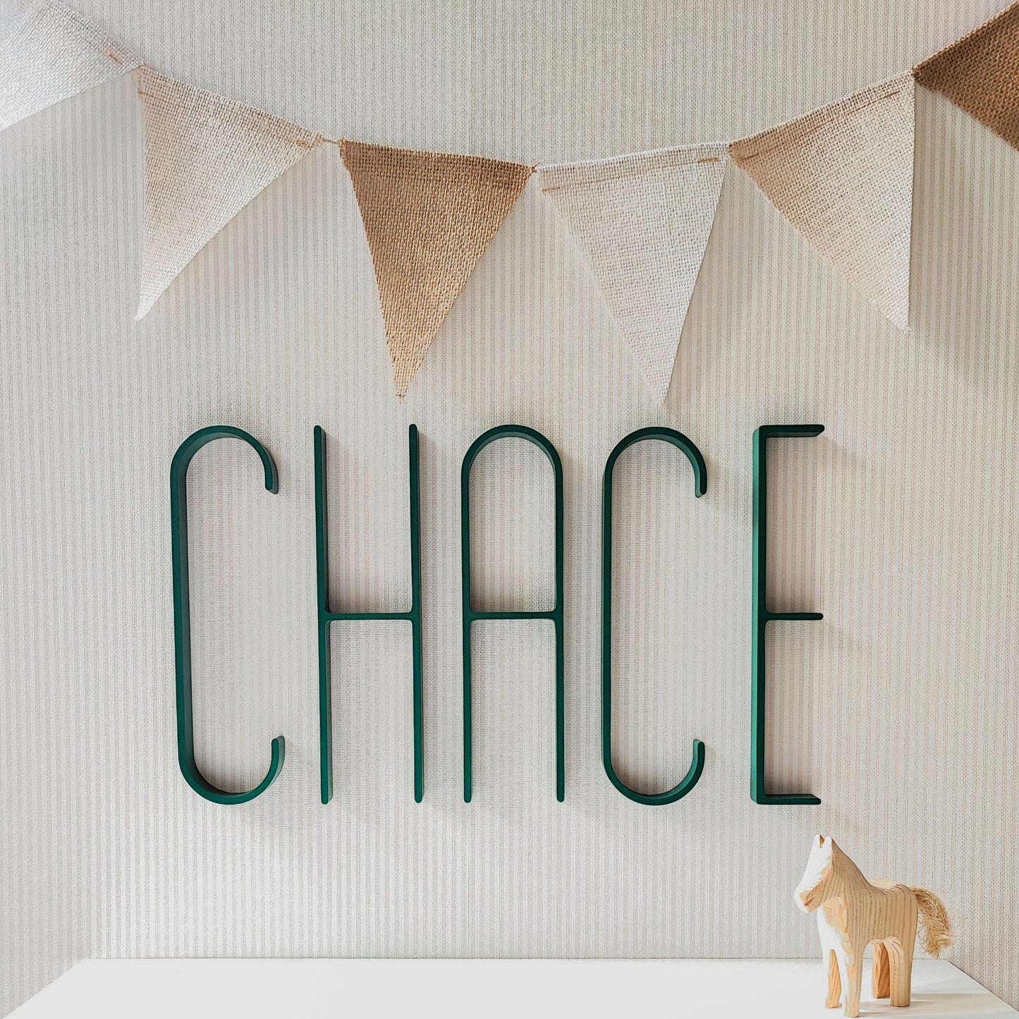 Emerald Green Chace name letters mid century modern style on a light wall net to neutral nursery decor by Lettrise